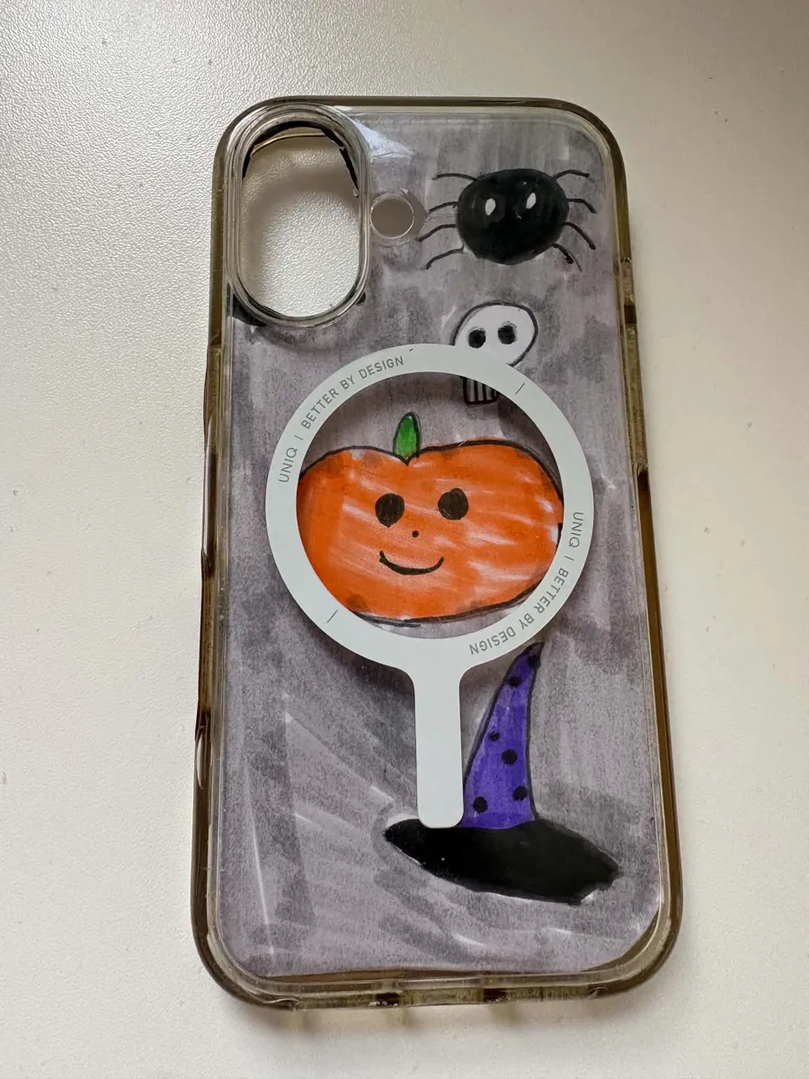 The same hand-drawn Halloween insert slid into a clear iPhone case